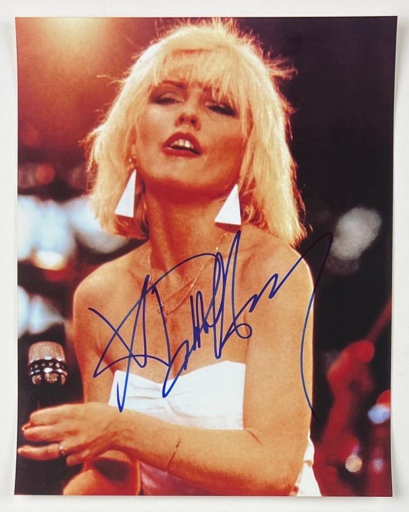 Blondie: Debbie Harry Signed 10" x 8" Photo (JSA Authentication): Color 10" x 8" photo signed in blue felt tip marker by Blondie band member Debbie Harry. In fine condition. Accompanied by a full Letter of Authenticity from JSA (#BB76310).