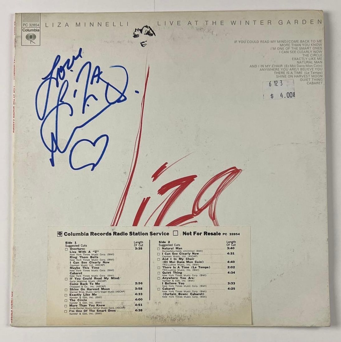 Liza Minnelli Signed "Liza Minnelli Live at the Winter Theater" Album (Beckett/BAS Authentication): "Liza Minnelli Live at the Winter Theater" signed on the cover in blue felt tip marker by musician and actress Liza Minnelli., who inscribed "Love" before her name and a heart after her