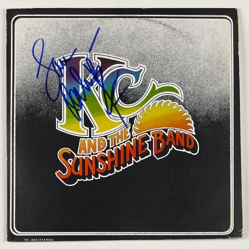 KC and The Sunshine Band: Harry Wayne Casey Signed "KC and the Sunshine Band" Album (Beckett): "KC and The Sunshine Band" album signed on the cover in blue felt tip marker by KC and the Sunshine Band band member Harry Wayne Casey, who inscribed the message "love" before his signature.
