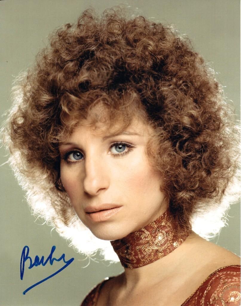 Barbra Streisand Signed 14" x 11" Photo (JSA Authentication): Color 14" x 11" photo signed in blue felt tip marker by actress and musician Barbra Streisand. In fine condition. Obtained in-person. Accompanied by a full Letter of Authenticity from JSA (#Z42971).