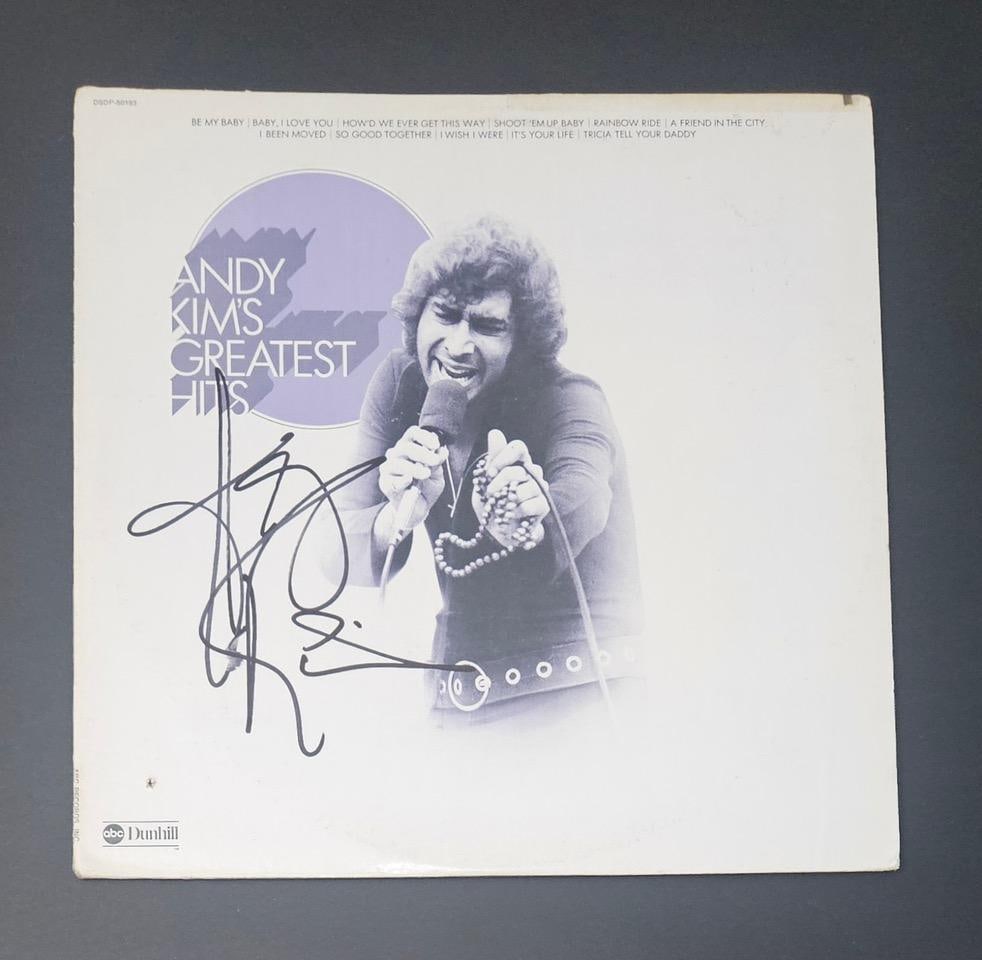 Andy Kim Signed "Andy Kim's Greatest Hits" Album (Third Party Guaranteed): "Andy Kim's Greatest Hits" album signed on the cover in black felt tip marker by musician Andy Kim. Measuring approximately 12" x 12" and in fine condition. Record is included. Obtained