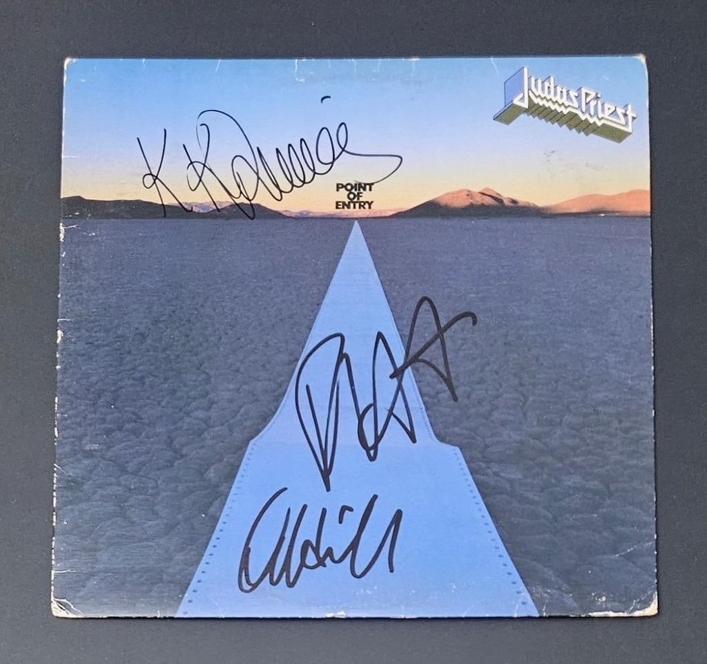 Judas Priest Group Signed "Point of Entry" Album (3 Sigs) (Third Party Guaranteed): "Point of Entry" signed on the cover in black felt tip marker by Judas Priest band members Rob Halford, KK Downing, and Ian Hill. Measuring approximately 12" x 12" and in fine condition. Record is