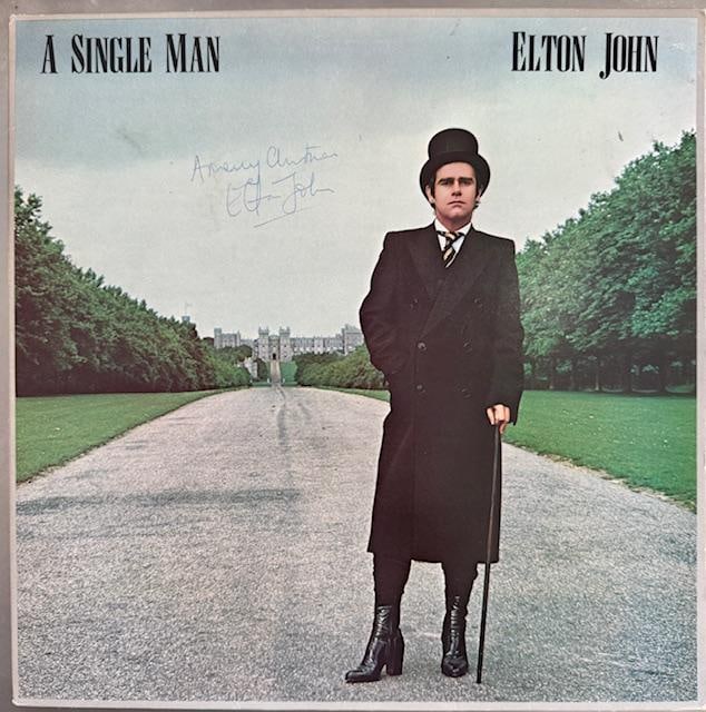 Elton John Signed “A Single Man” LP Album (Third Party Guaranteed): “A Single Man” LP album signed on the cover in blue ballpoint pen by musician Elton John, who also inscribed the message “A Merry Christmas” before his signature. Measuring