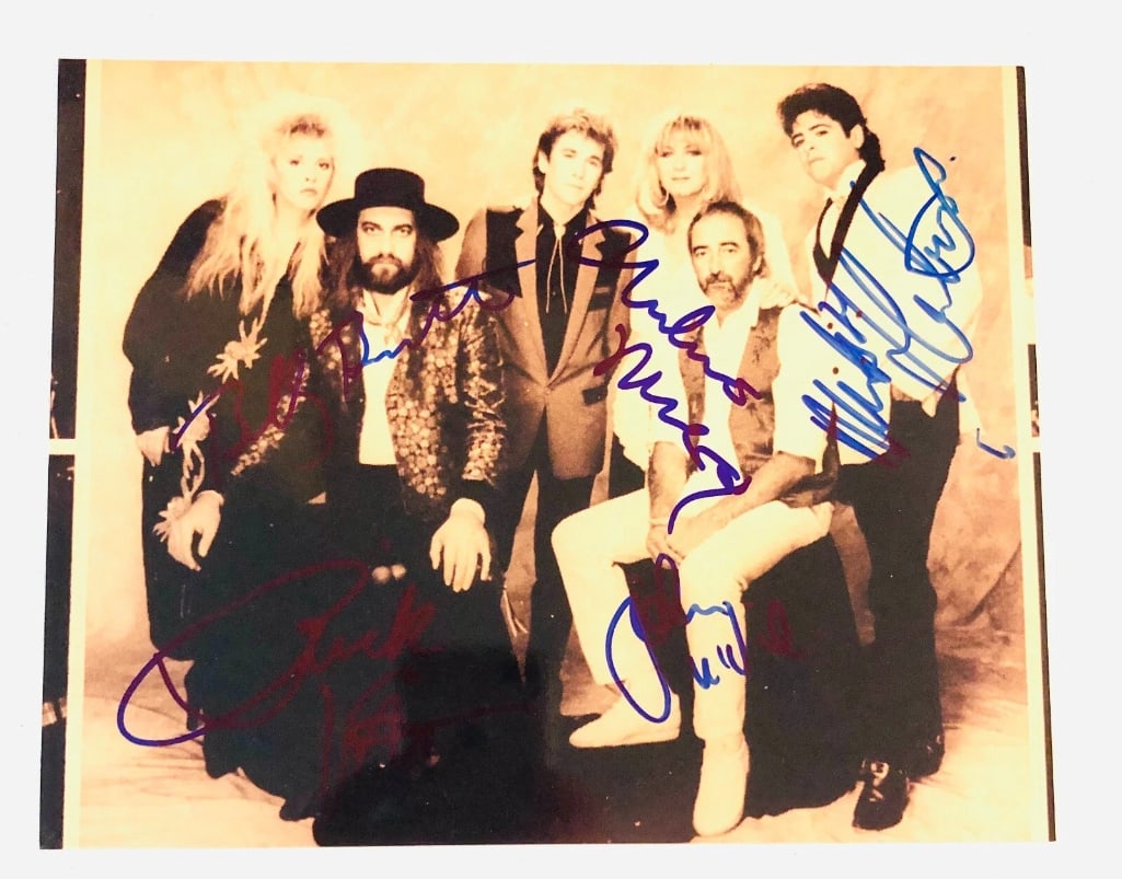 Fleetwood Mac Group Signed 8" x 10" Photo (5 Sigs) (JSA Authentication): Color 8" x 10" photo signed in blue felt tip marker by later line-up Fleetwood Mac band members Mick Fleetwood, John McVie, Christine McVie, Rick Vito, and Billy Burnette. In fine condition. Obtained