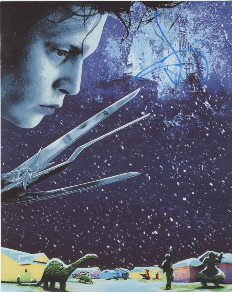 Edward Scissorhands: Johnny Depp Signed 14" x 11" Photo (ACOA Authentication): Color 14" x 11" photo of character Edward Scissorhands from the film "Edward Scissorhands" signed in blue paint pen by actor Johnny Depp. In fine condition. Obtained in-person. Accompanied by an ACOA