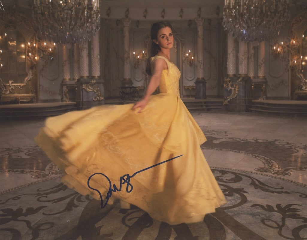 Beauty and the Beast: Emma Watson Signed 11" x 14" Photo as Belle (ACOA Authentication): Color 11" x 14" photo of character Belle from the film "Beauty and the Beast" signed in blue felt tip marker by actress Emma Watson. In fine condition. Obtained in-person. Accompanied by a ACOA COA