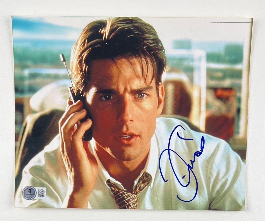 Jerry Maguire: Tom Cruise Signed 8" x 10" Photo as Jerry Maguire (Beckett/BAS Authentication): Color 8" x 10" photo of character Jerry Maguire from the film "Jerry Maguire" signed in blue felt tip marker by actor Tom Cruise. In fine condition. Obtained in-person. Accompanied by a full Letter