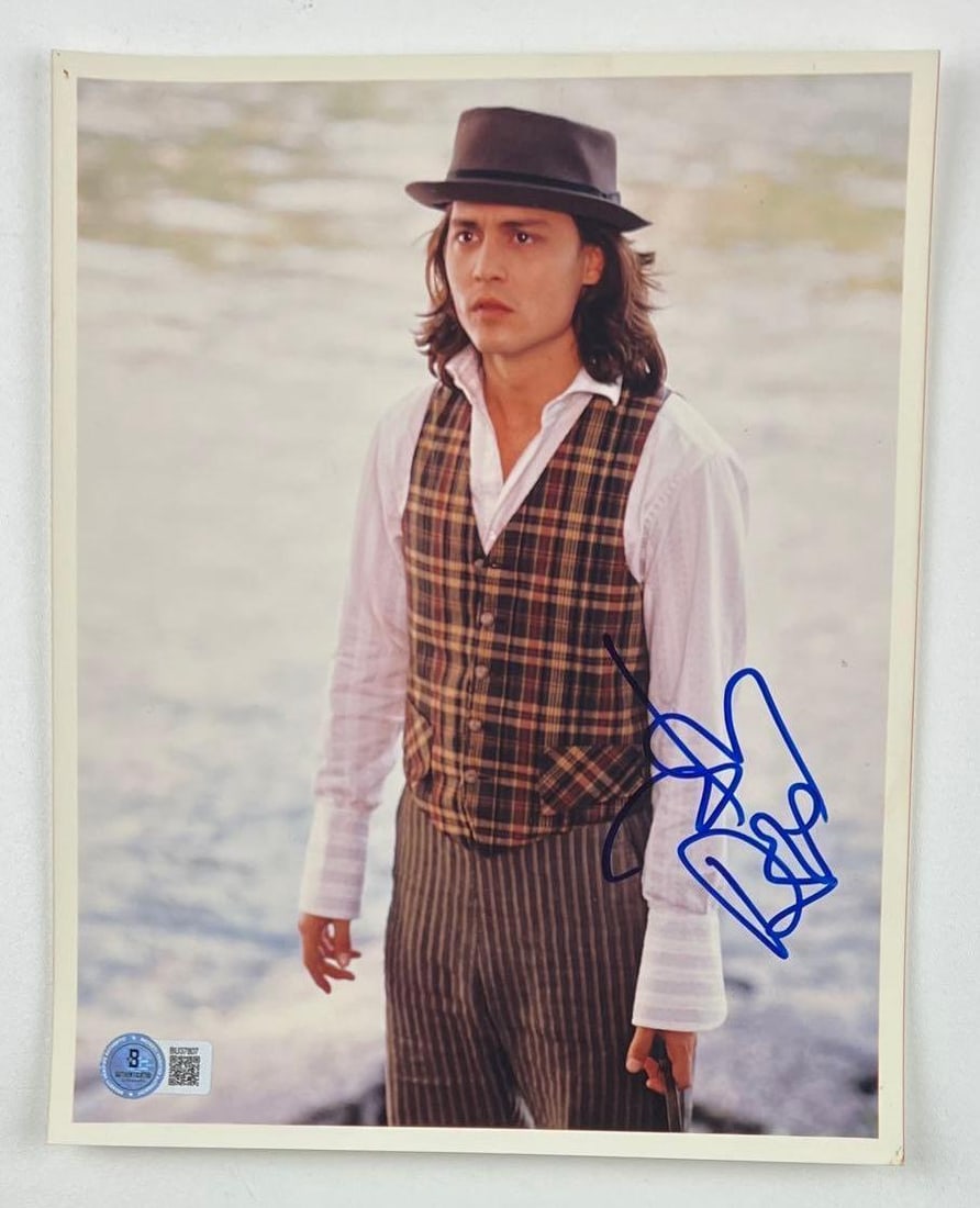 Benny & Joon: Johnny Depp Signed Photo as Benny Pearl (Beckett/BAS Authentication): Color 10" x 8" photo of character Benny Pearl from the film "Benny & Joon" signed in blue felt tip marker by actor Johnny Depp. In fine condition. Obtained in-person. Authenticated by Beckett/BAS,