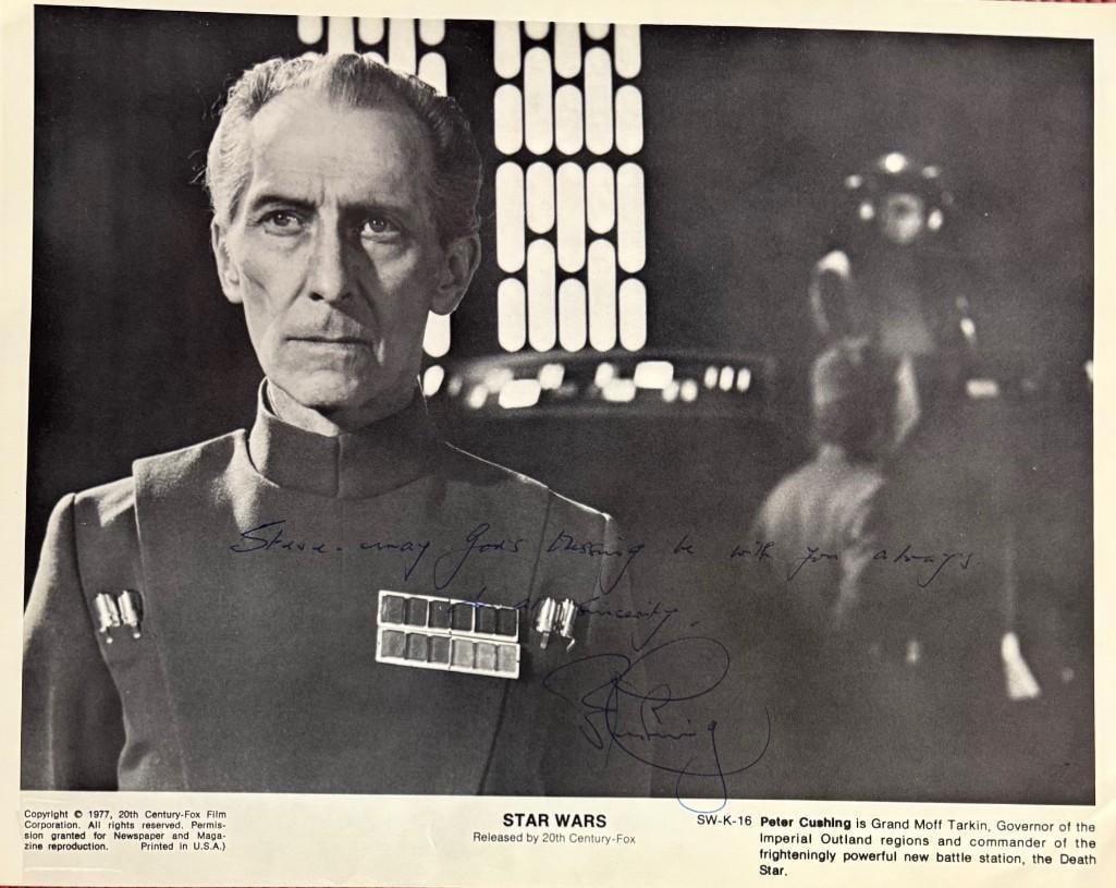 Star Wars: Peter Cushing Signed 8" x 10" Photo as Grand Moff Tarkin (JSA Authentication): Black-and-white 8" x 10" photo of the character Grand Moff Tarkin from the film "Star Wars" signed in blue ballpoint pen by actor Peter Cushing, who inscribed the message "Steve- may God's blessing