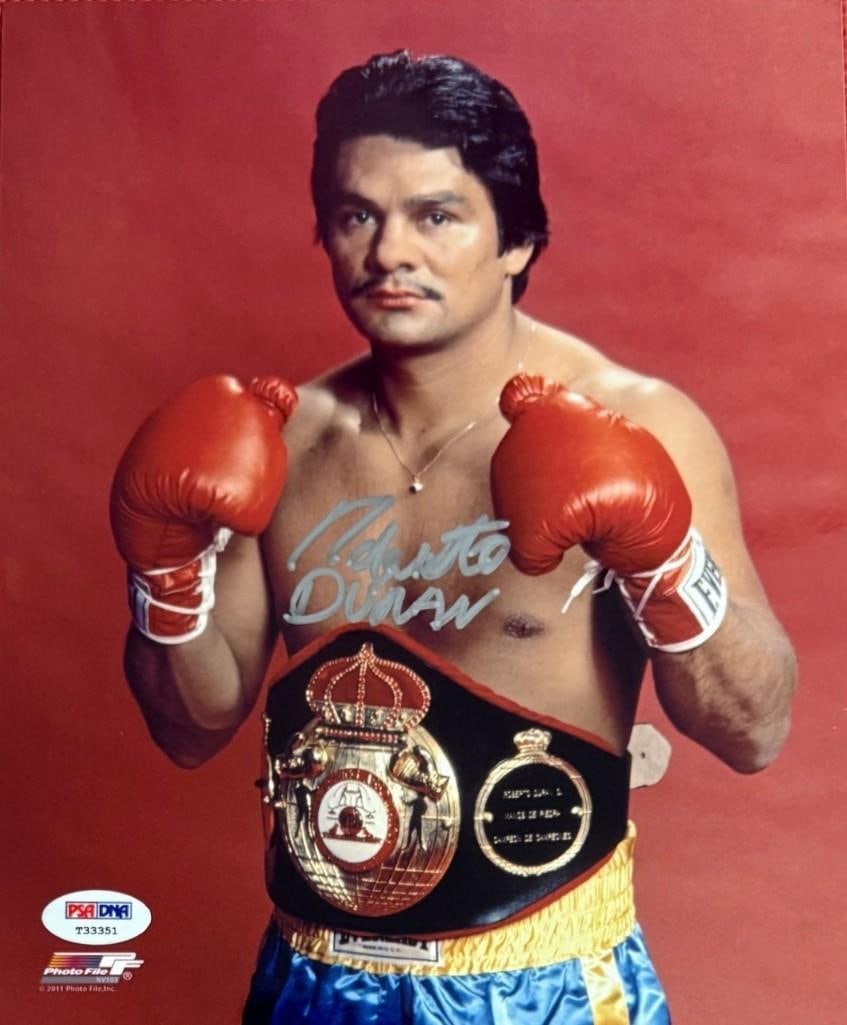 Robert Duran Signed 10" x 8" Photo (PSA DNA Authentication): Color 10" x 8" photo signed in silver felt tip marker by boxer Robert Duran. In fine condition. Accompanied by a PSA DNA COA (#T33351).