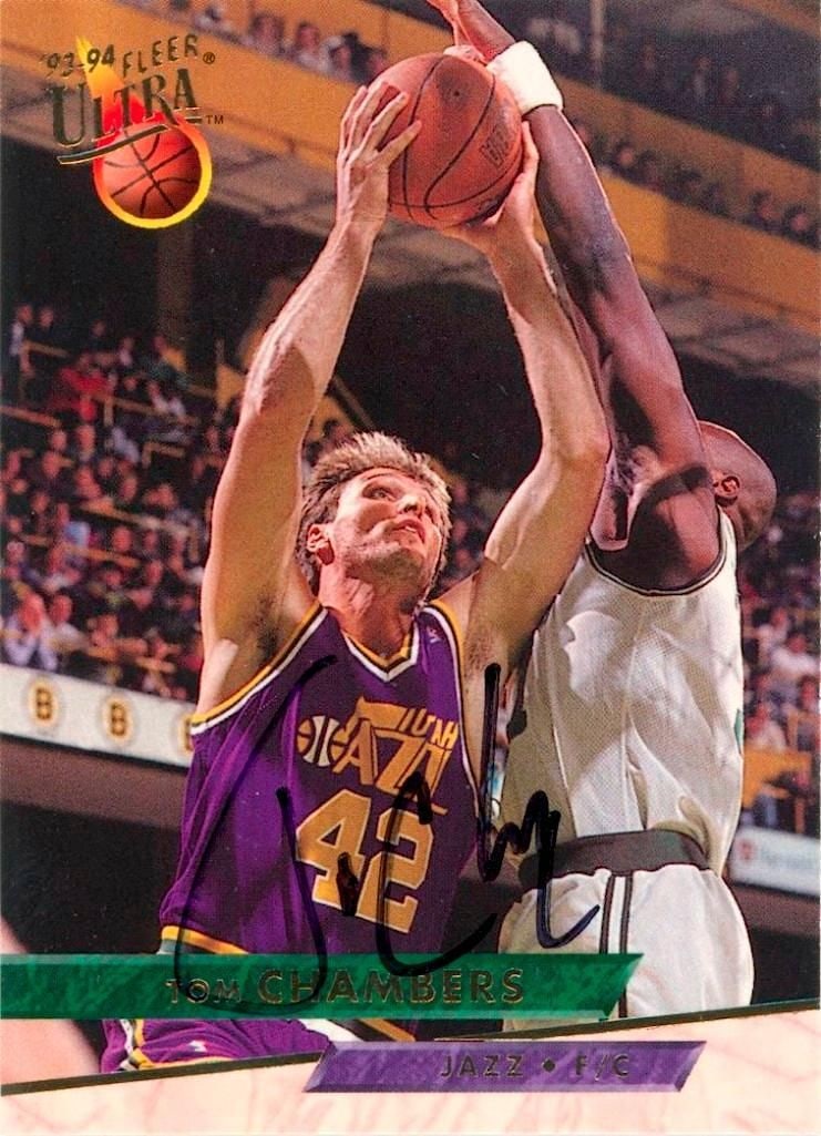 Tom Chambers Signed 1993-94 NBA Hoops Basketball Card (JSA Authentication): 1993-94 NBA Hoops basketball card #348 signed in black ink by Tom Chambers. The card measures approximately 3.5" x 2.5". Featuring Chambers in his Utah Jazz uniform during gameplay. In fine