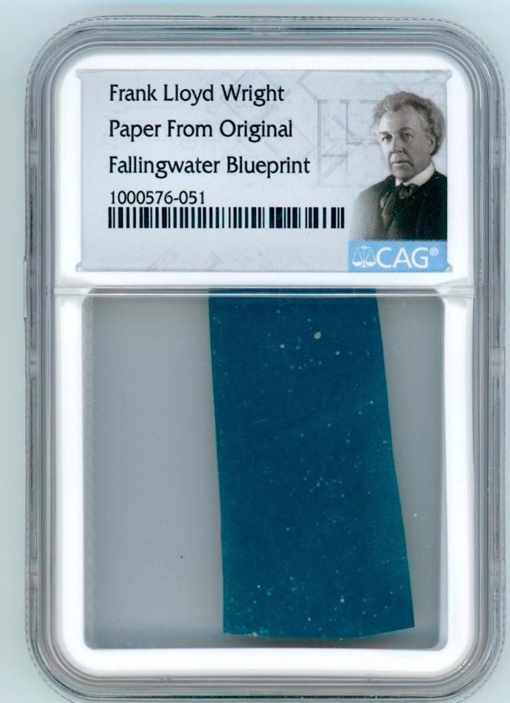 Frank Lloyd Wright Fallingwater Blueprint Swatch (CAG): Paper swatch, 1.75" x .75," removed from an original working blueprint for Fallingwater (Kaufmann House), Frank Lloyd Wright’s architectural masterpiece completed in 1939. Encapsulated by CAG to