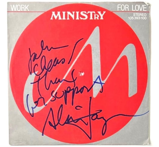 Ministry: Al Jourgensen Signed "Work for Love" 45 (Beckett/BAS Authentication): "Work for Love" 45 signed on the cover in blue felt tip marker by Ministry band member Al Jourgensen. Measuring approximately 7" x 7" and in good condition, with some scattered wear, including a hole