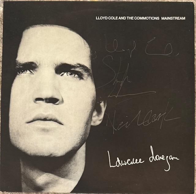 Lloyd Cole & The Commotions Fully Group Signed "Mainstream" LP Album (5 Sigs) (TPG): "Mainstream" LP album signed on the cover in white ballpoint pen and silver felt tip marker by front man Lloyd Cole, and his band mates Blair Cowan, Lawrence Donegan, Neil Clark, and Stephen Irvine.