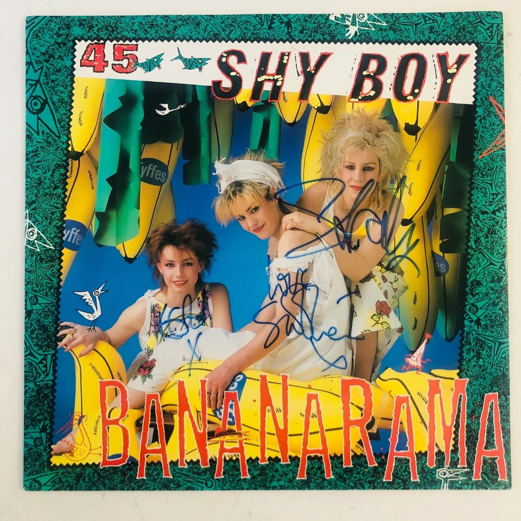 Bananarama Fully Group Signed "Shy Boy" Album (3 Sigs) (Beckett/BAS Authentication): "Shy Boy" album signed on the cover in blue felt tip marker by Bananarama band members Siobhan Fahey, Sara Dallin, and Keren Woodward. Measuring approximately 12" x 12" and in fine condition.