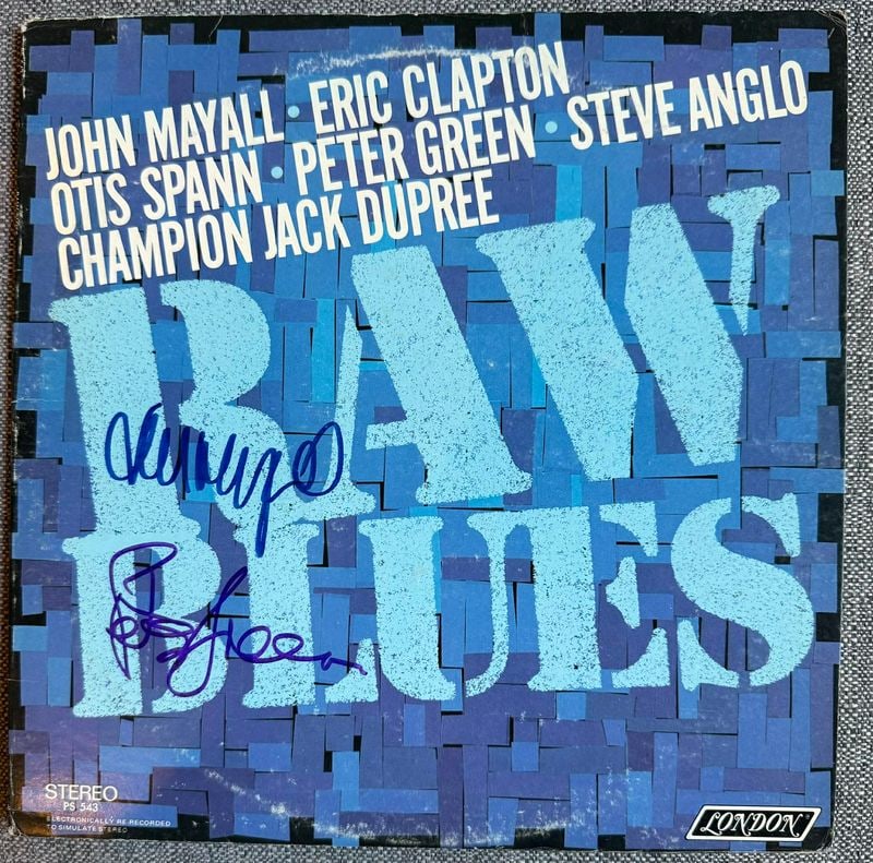 John Mayall & Peter Green Signed "Raw Blues" Album (2 Sigs) (ACOA Authentication): "Raw Blues" album signed on the cover in blue felt tip marker by musicians John Mayall and Peter Green. Measuring approximately 12" x 12" and in very good condition, with some scattered wear. Authenti