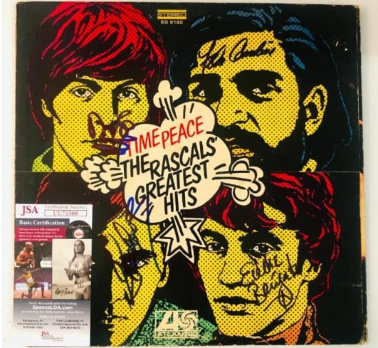 The Rascals Group Signed "Time Peace" Album (4 Sigs) (JSA Authentication): "Time Peace" album signed on the cover in blue and black felt tip markers by The Rascals band members Felix Cavaliere, Eddie Brigati, Dino Danelli, and Gene Cornish. Measuring approximately 12" x 12"