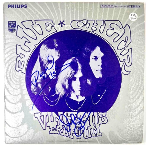 Blue Cheer: Dickie Peterson & Paul Whaley Signed "Vincebus Eruptum" Album (2 Sigs) (Beckett): "Vincebus Eruptum" album signed on the cover in blue felt tip marker by Blue Cheers band members Dickie Peterson and Paul Whaley. Measuring approximately 12" x 12" and in very good condition, with som