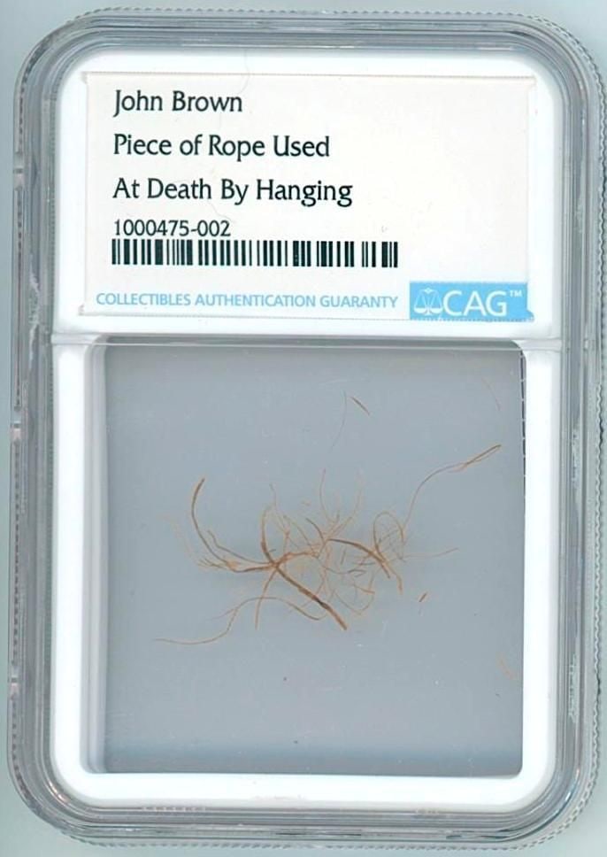 John Brown Strands from the Rope Used in His Hanging (CAG Encapsulated): Strands of rope believed to be from the noose used in the December 2, 1859 execution of abolitionist John Brown in Charles Town, Virginia. The relic was collected by Captain Richard Adams and is