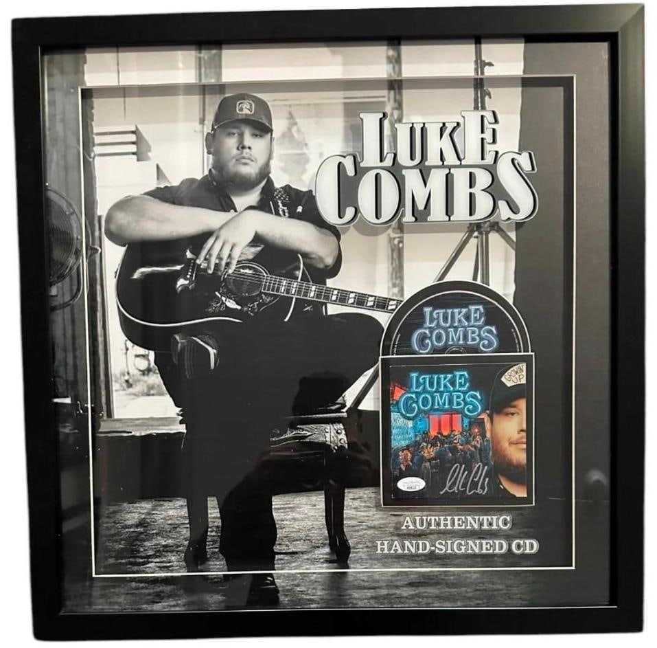 Luke Combs Signed "Growin' Up" CD Inside 22" x 22" Framed Display (JSA Authentication): "Growin' Up" CD signed on the cover in silver felt tip marker by country musician Luke Combs. Measuring approximately 5" x 5" and in fine condition. CD is included. CD is displayed in a frame