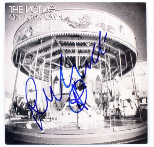 The Verve: Richard Ashcroft Signed “On Your Own” 45 (Beckett/BAS Authentication): “On Your Own” 45 signed on the cover in blue felt tip marker by The Verve band member Richard Ashcroft. Measuring approximately 7” x 7” and in fine condition. Special green