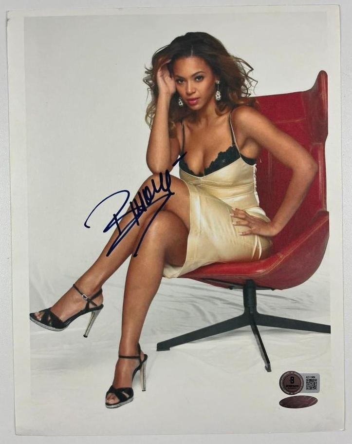 Beyonce Signed 10" x 8" Photo (Beckett/BAS Authentication): Color 10" x 8" photo signed in black felt tip marker by musician Beyonce. In fine condition. Obtained in-person. Accompanied by a full Letter of Authenticity from Beckett/BAS (#AE11989).