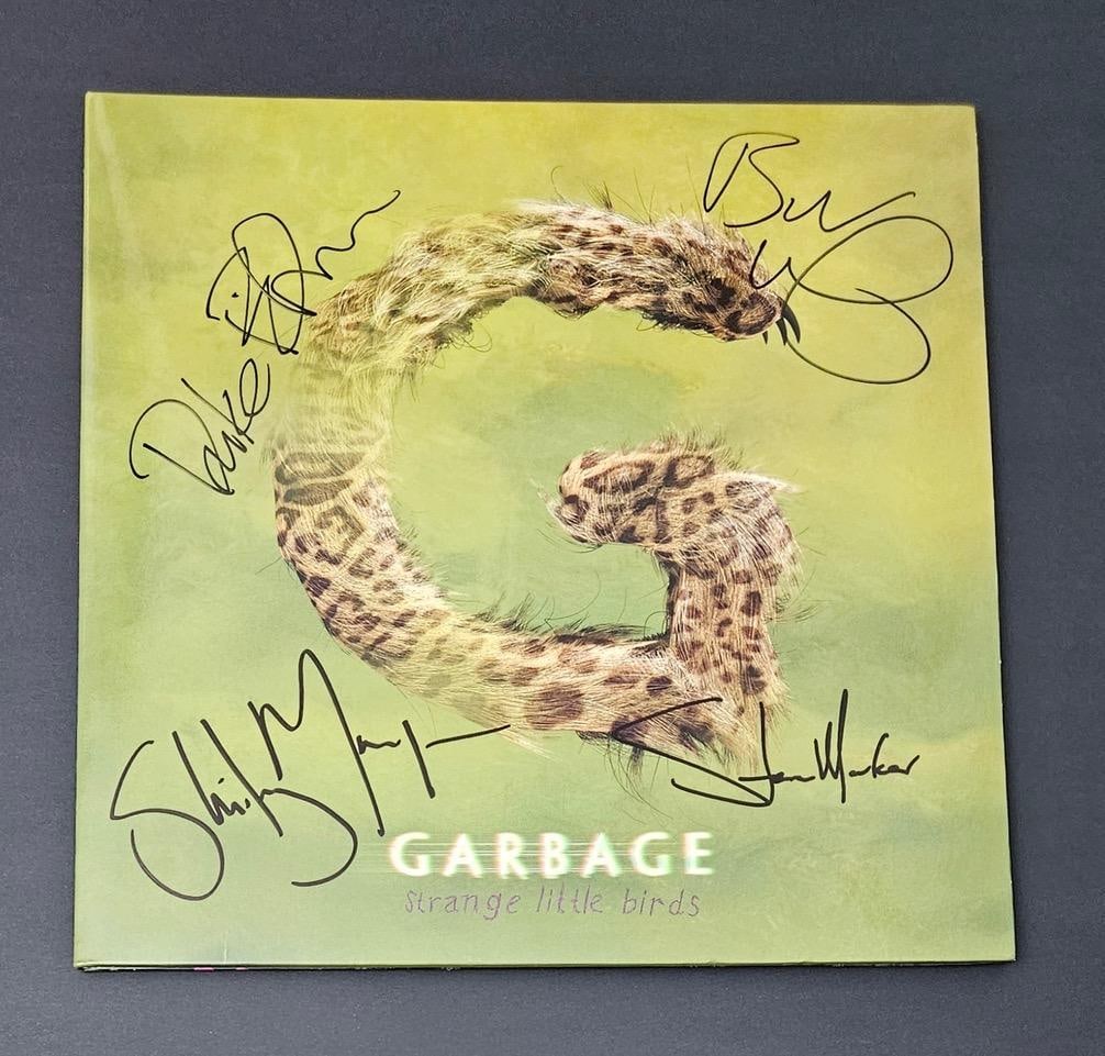 Garbage Group Signed "Strange Little Birds" Album (4 Sigs) (Third Party Guaranteed): "Strange Little Birds" album signed on the cover in black felt tip marker by Garbage band members Shirley Manson, Butch Vig, Steev Marker, and Duke Erikson. Measuring approximately 12" x 12" and in fi