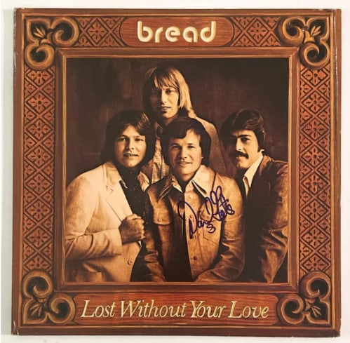 Bread: David Gates Signed "Lost Without Your Love" Album (Beckett/BAS Authentication): "Lost Without Your Love" album signed on the cover in blue felt tip marker by Bread band member David Gates. Measuring approximately 12" x 12" and in very good condition, with some signs of scattered