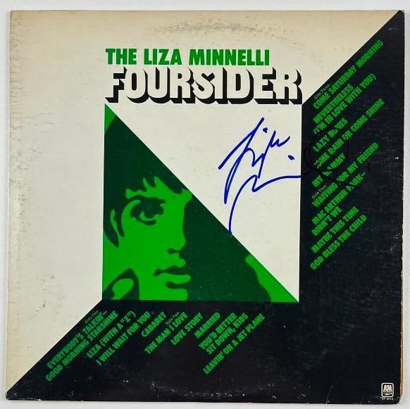 Liza Minelli Signed "Foursider" Album (JSA Authentication): "Foursider" album signed on the cover in blue felt tip marker by musician and actress Liza Minelli. Measuring approximately 12" x 12" and in fine condition. Obtained in-person. Record is included. Acc
