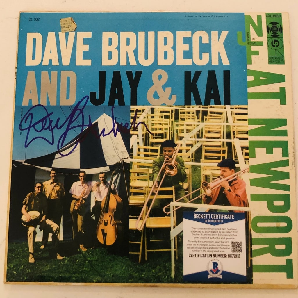 Dave Brubeck Signed "At Newport" LP Album (Beckett/BAS Authentication): "At Newport" LP album signed on the cover in blue felt tip marker by musician Dave Brubeck. Measuring approximately 12" x 12" and in fine condition. Obtained in-person. Record is included.