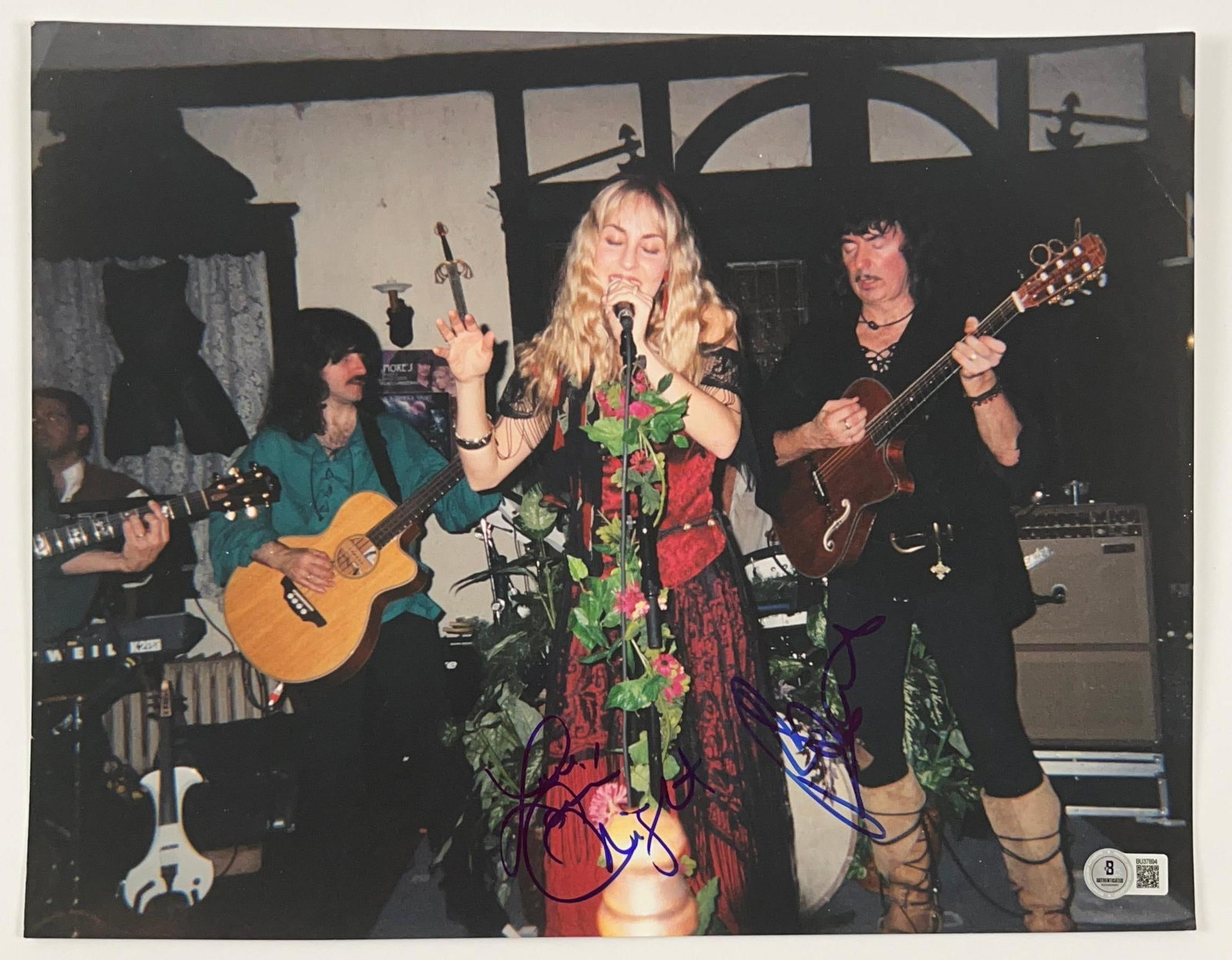 Deep Purple: Ritchie Blackmore & Candice Knight Signed 11" x 14" Photo (Beckett): Color 11" x 14" photo signed in blue felt tip marker by Ritchie Blackmore and his wife Candice Knight. In fine condition. Authenticated by Beckett/BAS, with their official hologram affixed to the