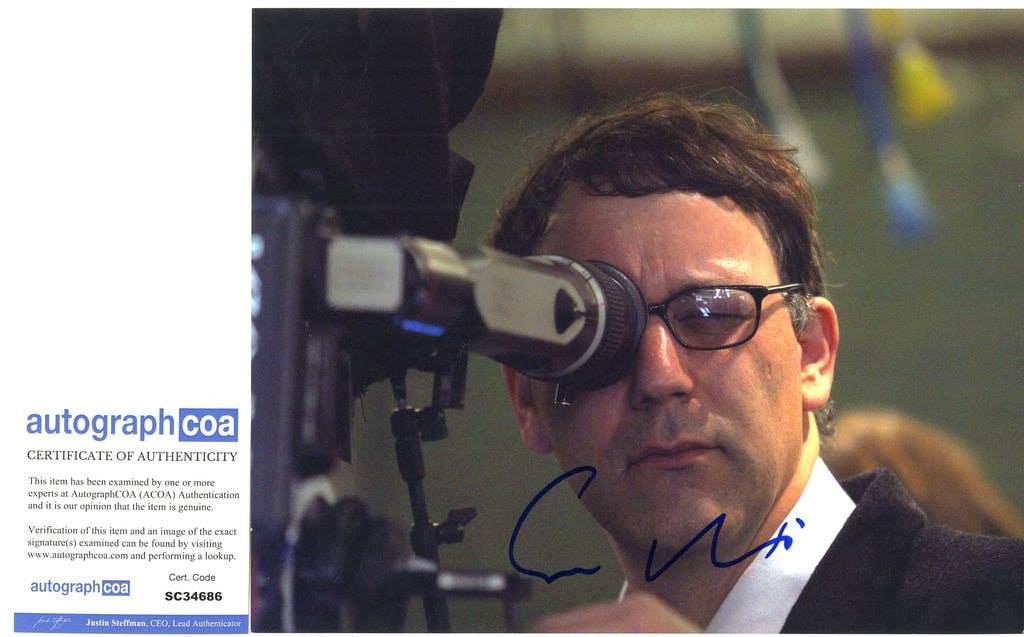 Sam Raimi Signed 8" x 10" Photo (ACOA): Color 8" x 10" photo signed in blue felt tip marker by director Sam Raimi, whose shown directing his film "Spider Man." In fine condition. Accompanied by an ACOA COA (#SC34686).