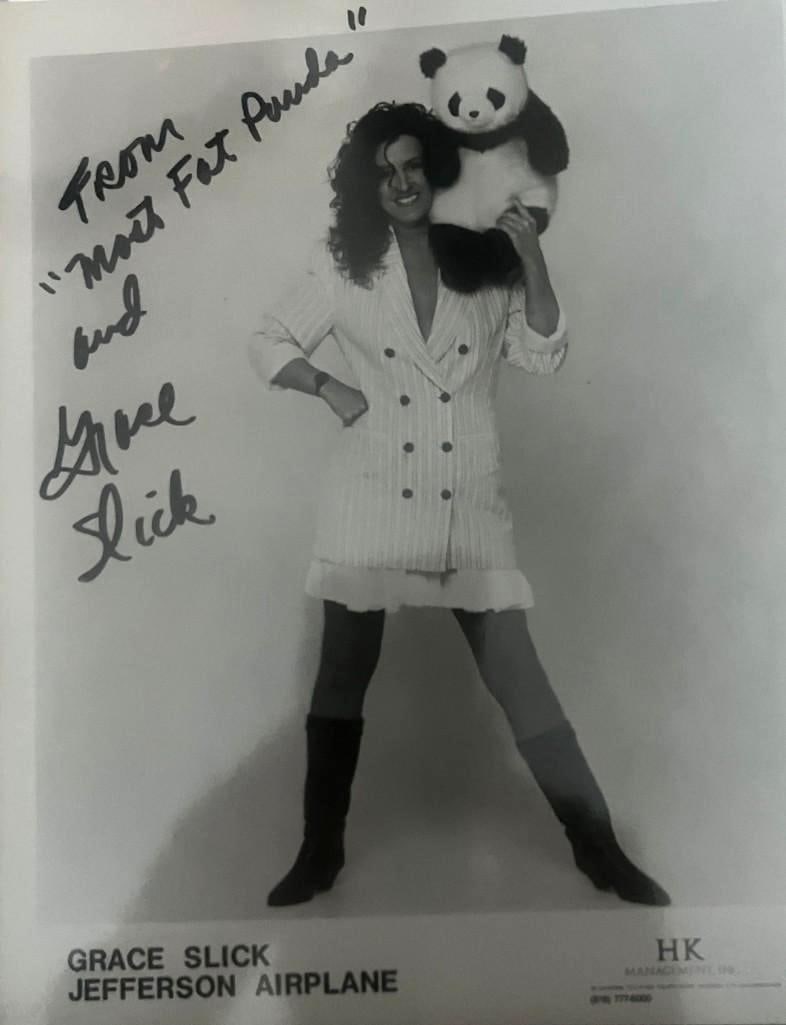 Jefferson Airplane: Grace Slick Signed 10" x 8" Promo Photo (PSA/DNA Authentication): Black-and-white 10" x 8" promotional photo signed in black felt tip marker by Jefferson Airplane band member Grace Slick, who also inscribed the message "From most fat panda" and "From" before her