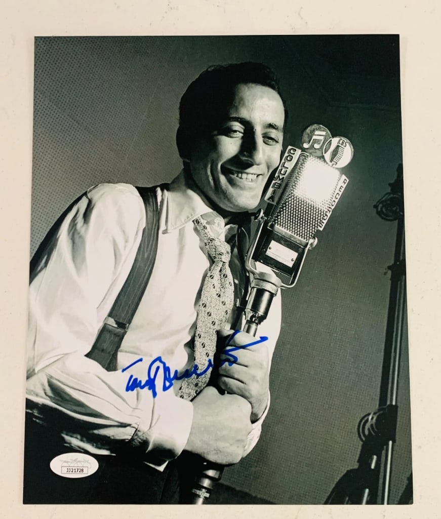 Tony Bennett Signed 10" x 8" Photo (JSA Authentication): Black-and-white 10" x 8" photo signed in blue felt tip marker by musician and signer Tony Bennett. In fine condition. Authenticated by JSA, with their official hologram affixed to the front bottom