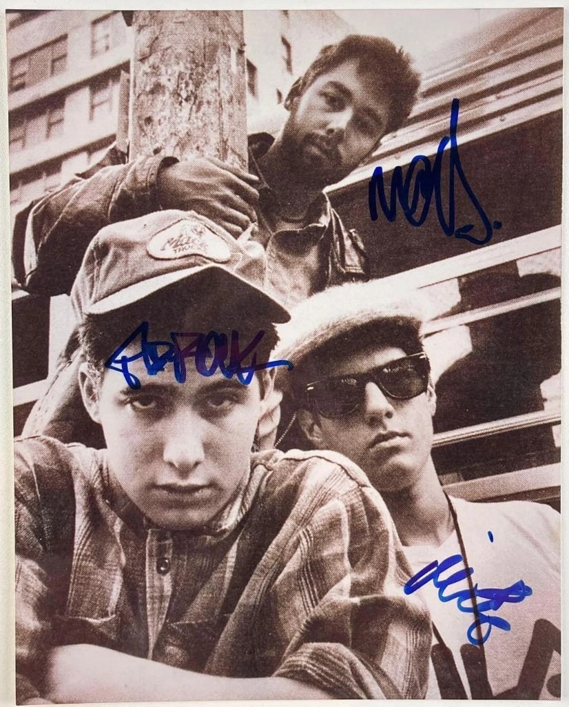 Beastie Boys Group Signed 10" x 8" Photo (3 Sigs) (Beckett Authentication): Rare black-and-white 10" x 8" photo signed in blue felt tip marker by Beastie Boys band members Adam "Ad-Rock" Horovitz, Adam "MCA" Yauch, and Michael "Mike D" Diamond. In fine condition. Accompanied