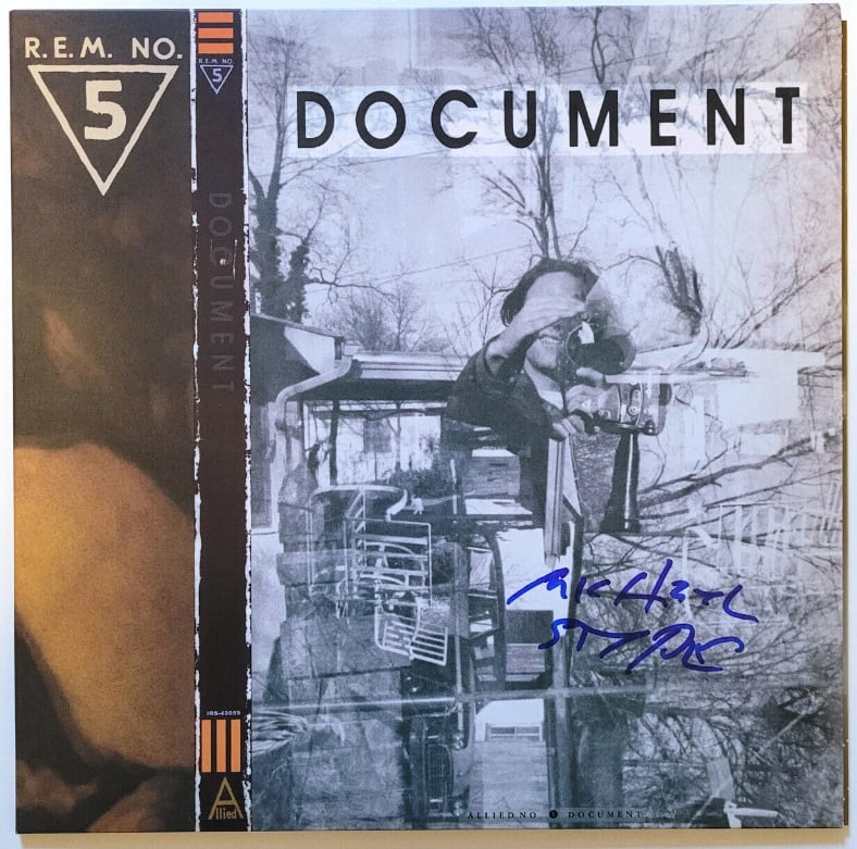 R.E.M: Michael Stipe Signed "Document" Album (Beckett/BAS Authentication): "Document" album signed on the cover in blue felt tip marker by R.E.M band member Michael Stipe. Measuring approximately 12" x 12" and in fine condition. Authenticated by Beckett/BAS, with their