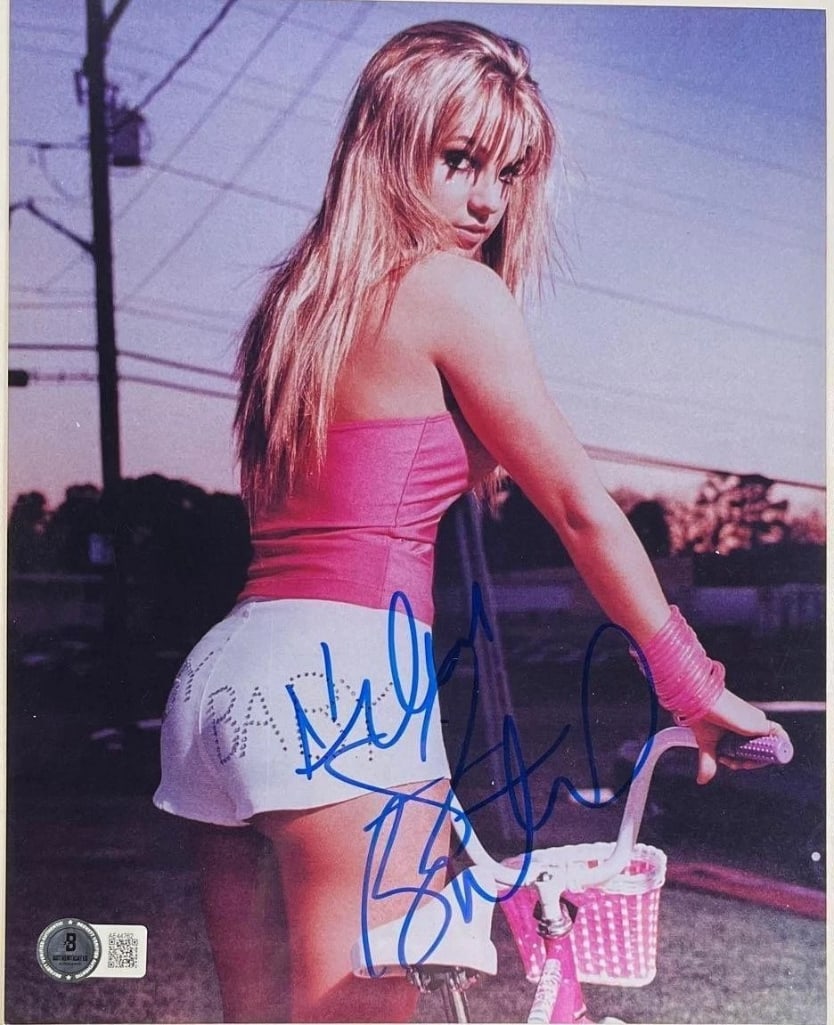 Britney Spears Signed 10" x 8" Photo (Beckett Authentication): Stunning color 10" x 8" photo signed in blue felt-tip marker by pop icon Britney Spears, in fine condition and accompanied by a full Letter of Authenticity from Beckett/BAS (#AF44762). Obtained