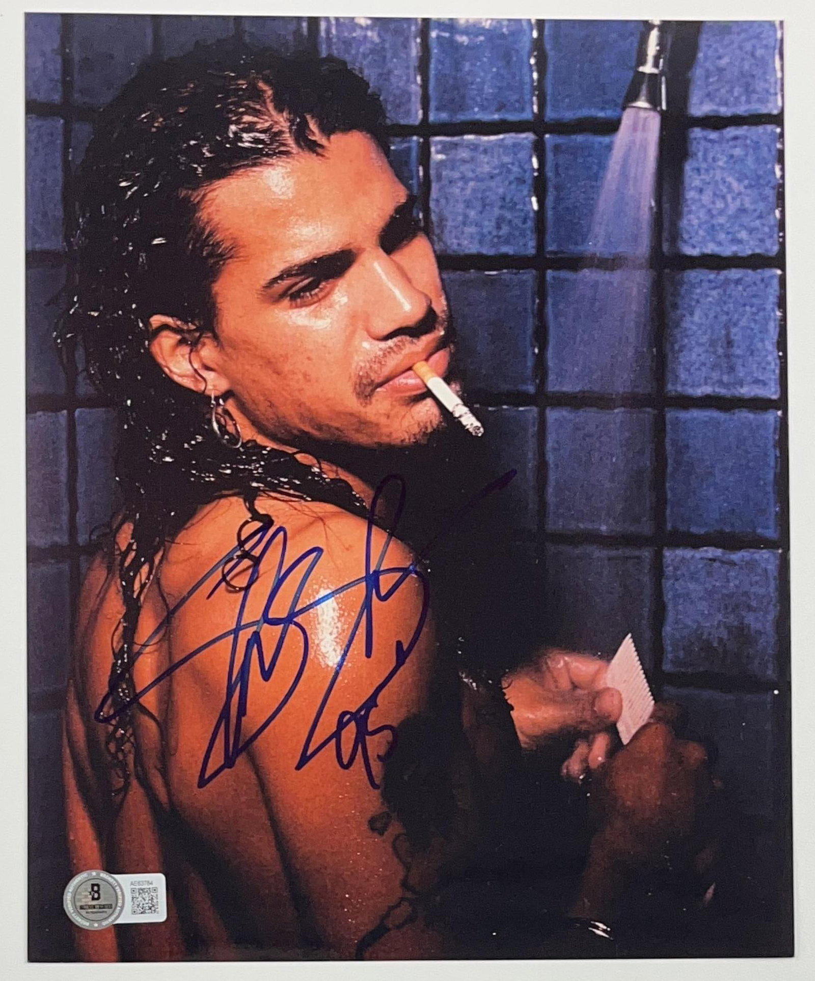 Guns N' Roses: Slash Signed 10" x 8" Photo (Beckett Authentication): Color 10" x 8" photo signed in blue felt tip marker by Guns N' Roses band member Slash. In fine condition. Accompanied by a full Letter of Authenticity from Beckett (#AE63784). Obtained in-person.