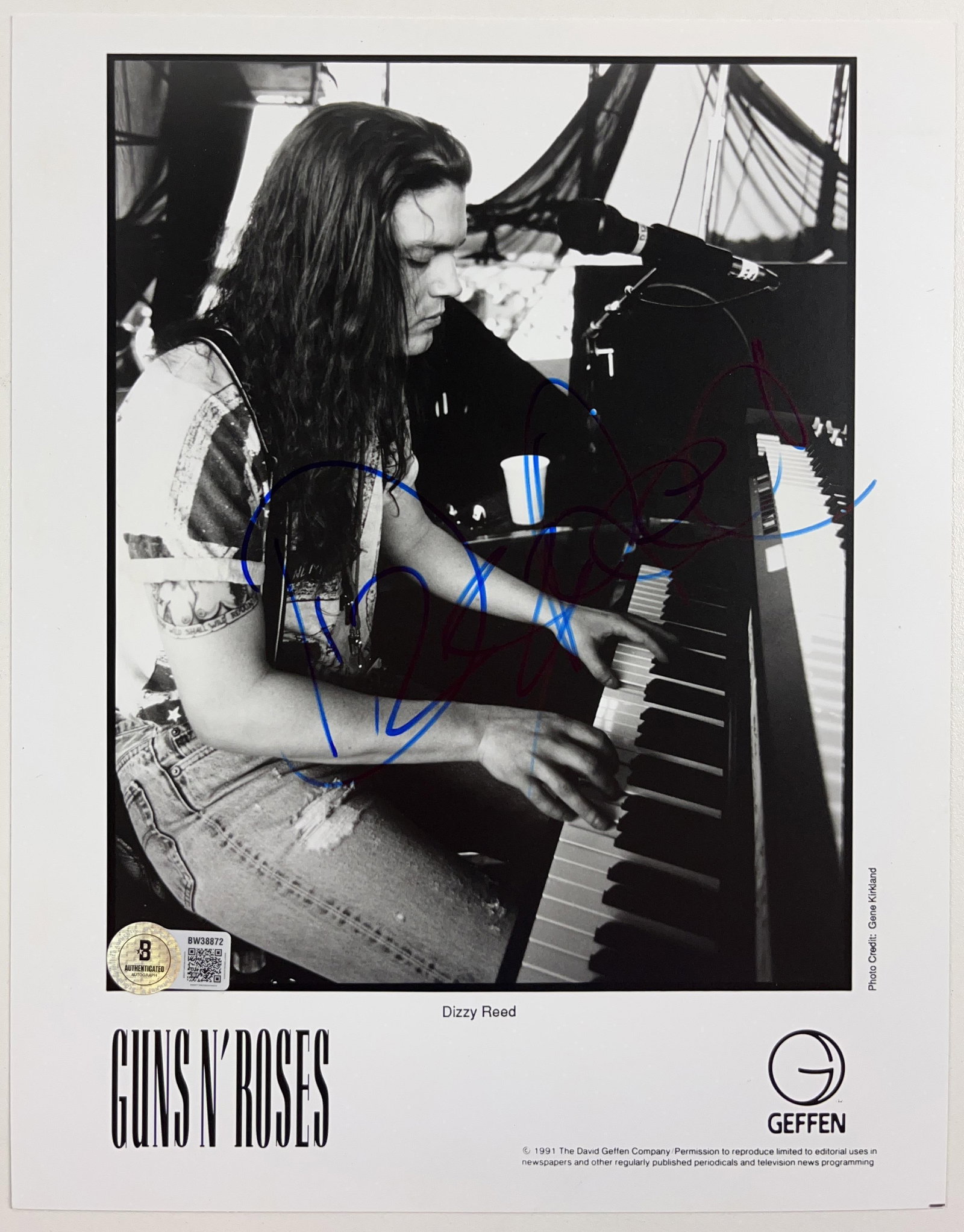 Guns N' Roses: Dizzy Reed Signed 10" x 8" Promo Photo (Beckett Authentication): Black-and-white 10" x 8" promotional photo signed in blue felt tip marker by Guns N' Roses band member Dizzy Reed. In fine condition. Authenticated by Beckett, with their official hologram affixed to