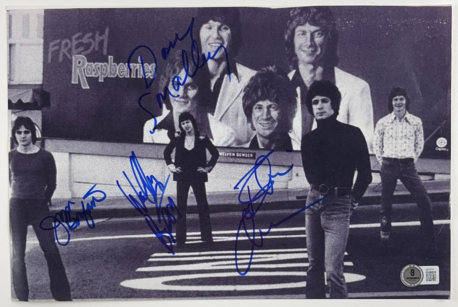 Raspberries Fully Signed 8" x 12" Photo (4 Sigs) (Beckett Authentication): Black-and-white 8" x 12" photo signed in blue felt tip markers by the Raspberries band members Dave Smalley, Wally Bryson, Jim Bonfanti, and Eric Carmen. In fine condition. Accompanied by a full