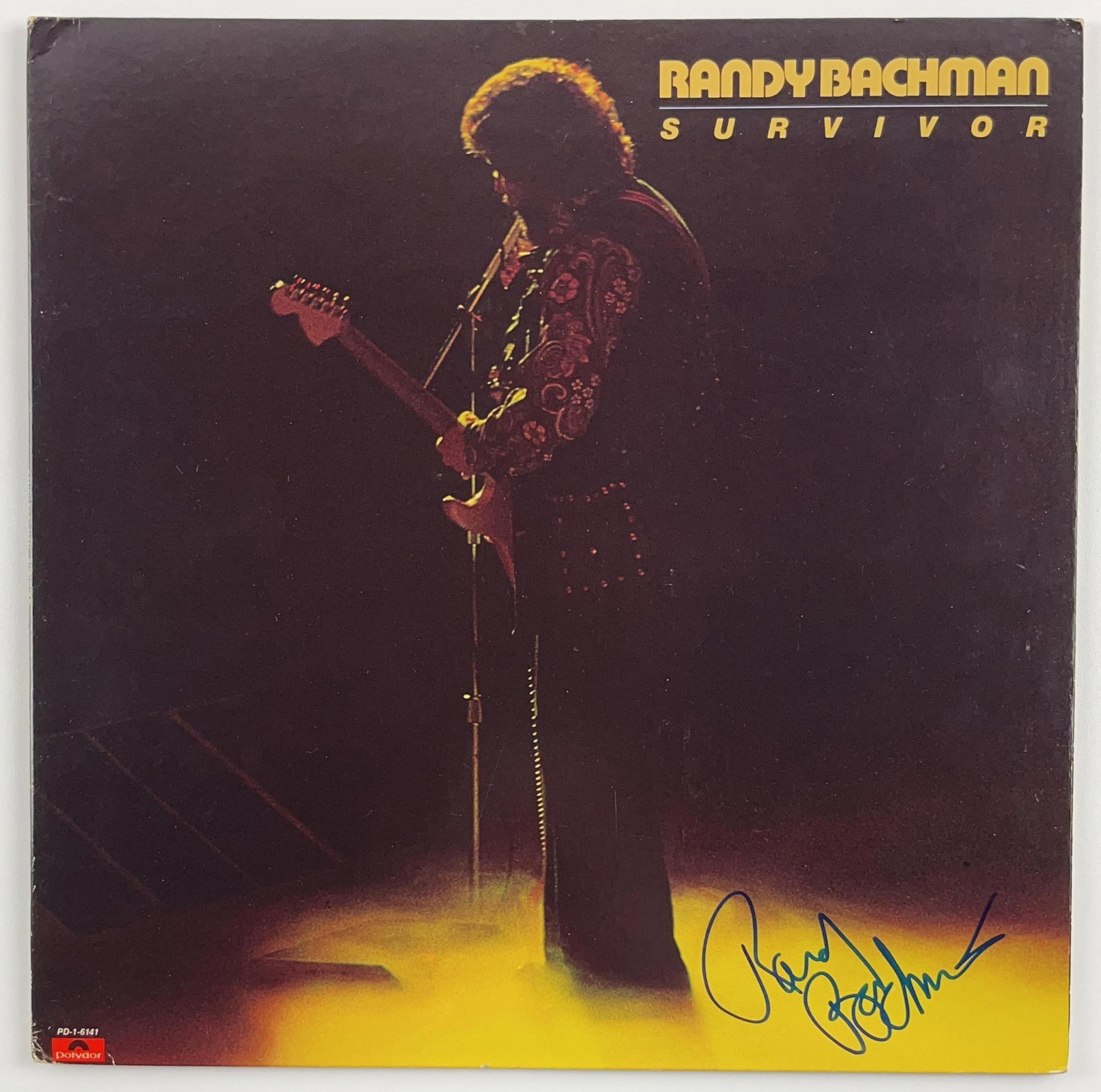 Randy Bachman Signed "Survivor" Album (Beckett/BAS Authentication): "Survivor" album signed on the cover in blue felt tip marker by musician Randy Bachman. Measuring approximately 12" x 12" and in fine condition. Authenticated by Beckett/BAS.