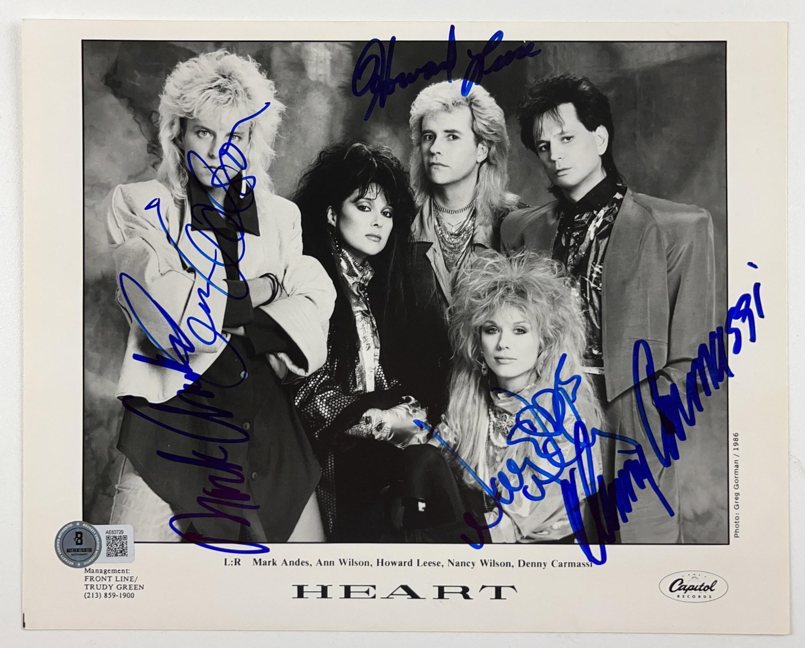 Heart Group Signed 8" x 10" Promo Photo (5 Sigs) (Beckett Authentication): Black-and-white 8" x 10" promotional photo signed in blue felt tip marker by Heart band members Mark Andes, Howard Leese, Ann Wilson, Nancy Wilson, and Denny Carmassi. In fine condition. Accompanied b