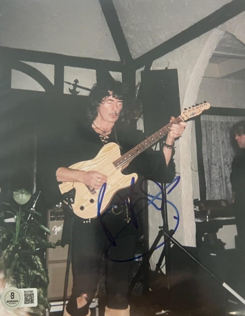 Deep Purple: Ritchie Blackmore Signed 10" x 8" Photo (Beckett Authentication): Color 10" x 8" photo signed in blue felt tip marker by Deep Purple band member Deep Purple. In fine condition. Authenticated by Beckett, with their official hologram affixed to the front bottom left