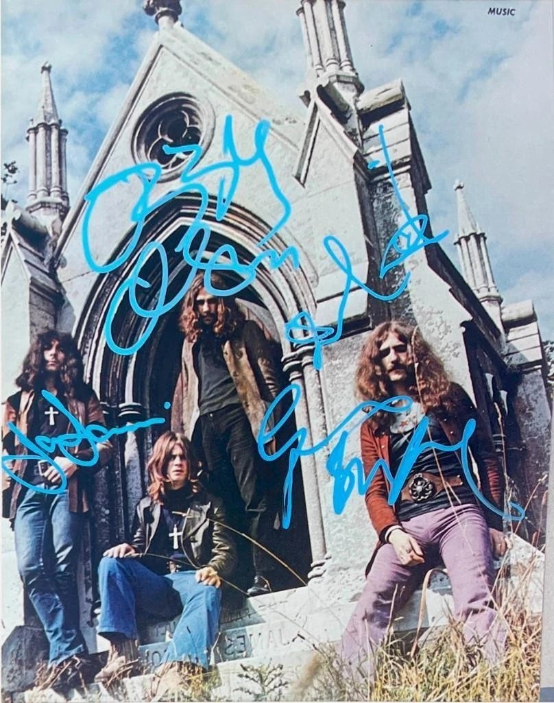 Black Sabbath Group Signed 14" x 11" Photo (4 Sigs) (Beckett Authentication): Sought-after color 14" x 11" photo signed in blue paint pen by Black Sabbath band members Ozzy Osbourne, Tony Iommi, Geezer Butler, and Bill Ward. In fine condition. Accompanied by a full Letter of Au