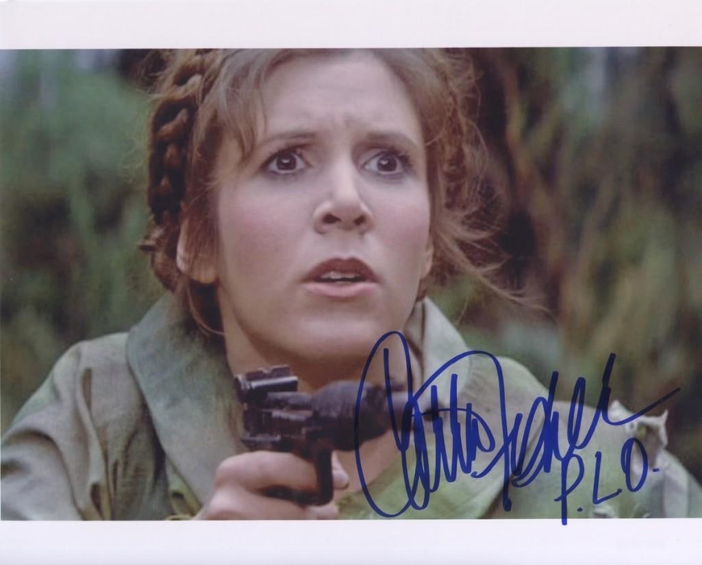 Star Wars: Carrie Fisher Signed 8" x 10" Photo (Third Party Guaranteed): Color 8" x 10" photo of the character Princess Leia from the film "Star Wars: Return of the Jedi," signed in blue felt tip marker by actress Carrie Fisher. In fine condition. Provenance Eaton &