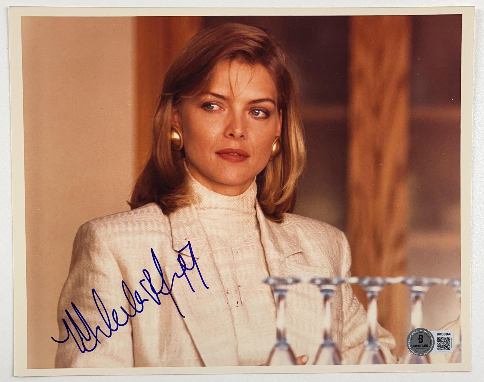 Tequila Sunrise: Michelle Pfeiffer Signed 8" x 10" Photo as Jo Ann Vallenari (Beckett Auth.): Color 8" x 10" photo of character Jo Ann Vallenari from the film "Tequila Sunrise" signed in blue felt tip marker by actress Michelle Pfeiffer. In fine condition. Authenticated by Beckett, with their