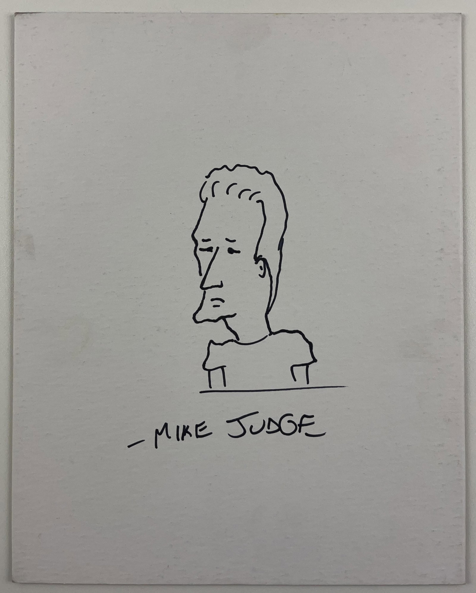King of the Hill: Mike Judge Signed 14" x 11" "Jeff Boomhauer" Drawing (Beckett Authentication): White paper 14" x 11" of the character Jeff Boomhauer from the television show "King of the Hill" signed in black felt tip marker by animator Mike Judge. In fine condition. Authenticated by Beckett,