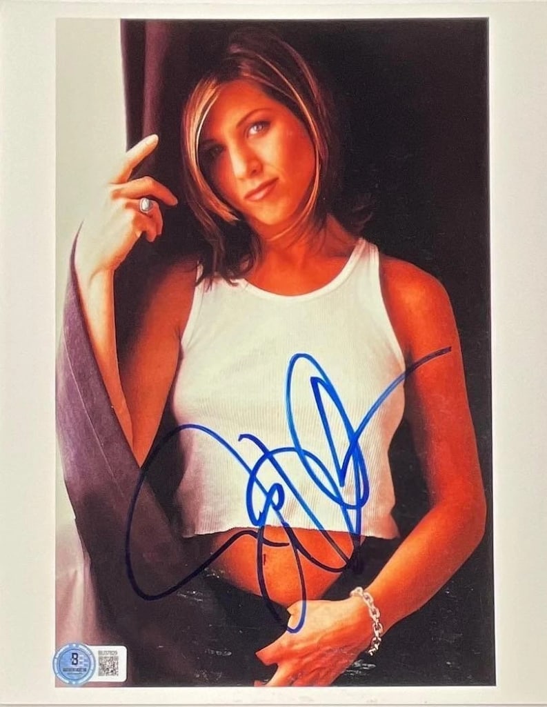 Friends: Jennifer Aniston Signed 10" x 8" Photo (Beckett Authentication): Color 10" x 8" photo signed in blue felt tip marker by actress Jennifer Aniston. In fine condition. Authenticated by Beckett, with their official hologram affixed to the front bottom left corner