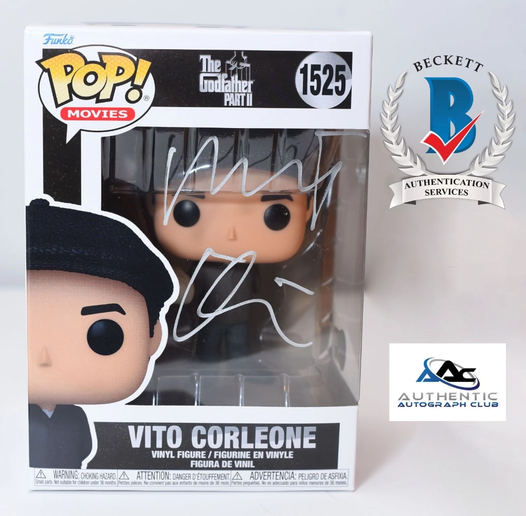 Godfather II: Robert DeNiro Signed "Vito Corleone" Funko Pop #1525 (Beckett Authentication): "Godfather II" Vito Corleone Funko Pop #1525 signed on the front plastic window in silver metallic marker by actor Robert DeNiro. Measuring approximately 6.25" x 4.5" x 3.5" and in fine condition. Aut