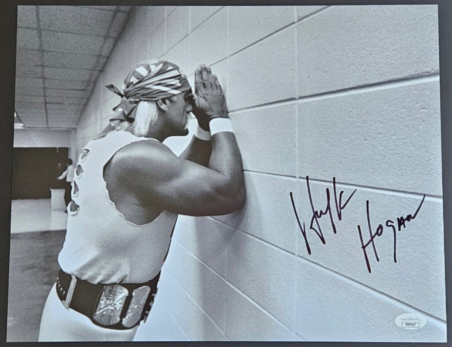 Hulk Hogan Signed 11" x 14" Photo (JSA Authentication): Black-and-white 11" x 14" photo signed in black felt tip marker by professional wrestler Hulk Hogan. In fine condition. Authenticated by JSA, with their official hologram affixed to the front bottom